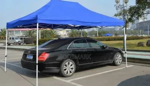 Imported Foldable Canopy 10 by 15 Feet White Pole Blue Roof.