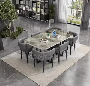 6 Seater Dining Table and Leather Seats in Grey Colour.