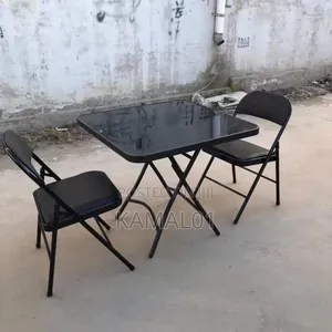 Folding Table With Tempered Glass on It and With 2 Chairs