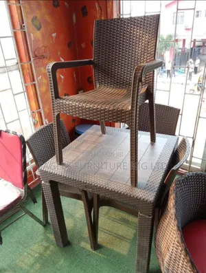 A Set of 4 Seater Outdoor Chairs and Table