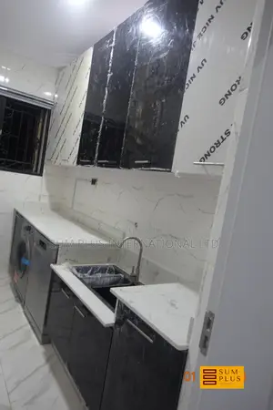 Fitted HDF Cabinets and Quartz Worktop for Laundry Room