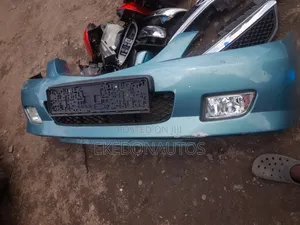 Complete Front Bumper for Mazda 323f 2003 Model