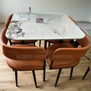 Modern Marble-Top Dining Table With Leather Chairs.