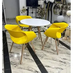 Round Beechwood Dining Table With 3 Yellow Sitting Chairs