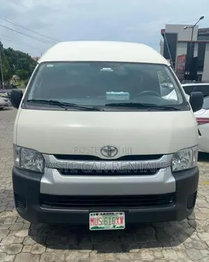 Air-Conditioned White Toyota Hiace for Rent.