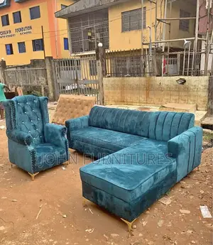 L Shaped Gray Leather Sofa With an Arm Chair