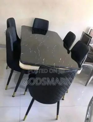 Black Marble Dining Set With Leather Seats.