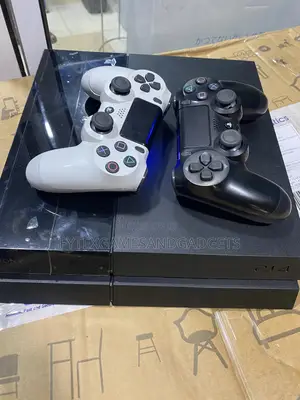 Playstation 4 Fat 500gb With 2 Quality Pads and 12 Games