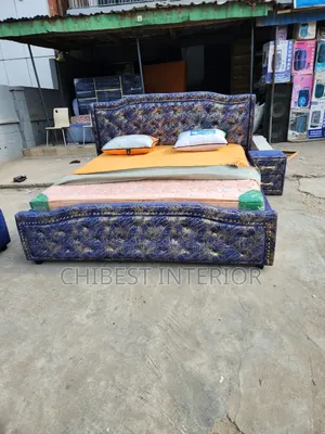 An Upholstery 6by6 Bed With a Two Step Drawer