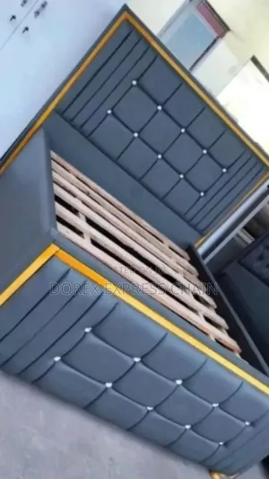Luxury King-size Bed Frame With Golden Steel Accents.