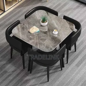Black Chairs and Marble Top Table
