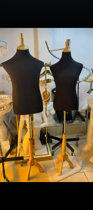Male And Female Body Form With Wooden Tripod Stand