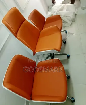 Office Chair Swivel in Orange and White Colour.