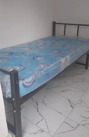 Single Metal Bed and Mattress 6 by 3 Feet.