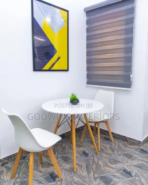 Round Table With Two Padded Chairs