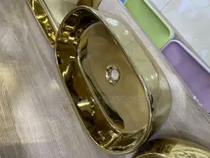 Luxury Gold Oval Countertop Wash Basin – Modern Ceramic Sink