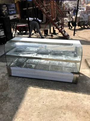 A Foreign Curved Glass Food Warmer Bain Marie Machine