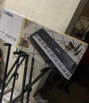Yamaha PSR E273 Piano With Adaptor.