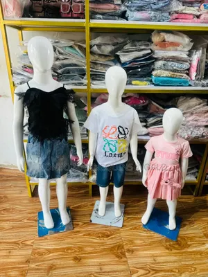 Different Sizes And Ages Of Glossy White Kids Mannequin