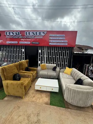 Set of Chairs and Throw Pillows With Center Table