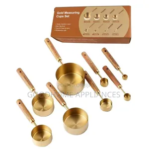 A Set of Eight Stainless Steel Measuring Cups Wooden Handle