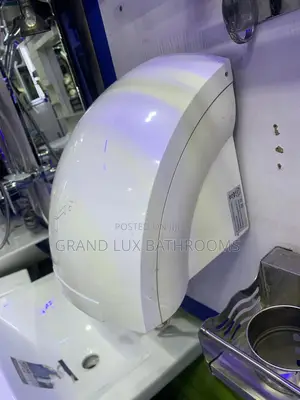 Wall-mounted Automatic Hand Dryer In Modern Bathroom