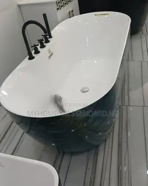 Luxurious Freestanding Bathtub With Tap and Hand Shower.