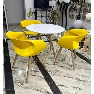 Round Beechwood Dining Table With 3 Yellow Sitting Chairs