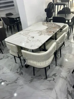 Brand New Six Leather Chairs With Its Marble Top.