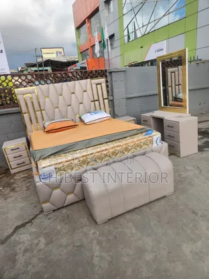 Cream Coloured Six by Six Leather Upholstery Bed.