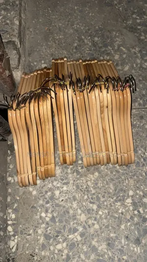 A Pack Of Neat Wooden Clothes Hangers