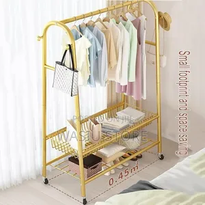Golden Freestanding Clothes Rack With Wheels
