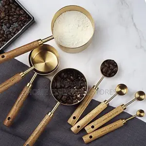 Set of Stainless Steel Measuring Cups With Wooden Handle