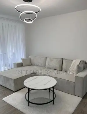 L-Shaped Fabric Sofa With a Center Table Can Be Made in Colo
