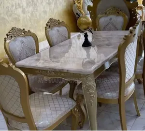 Set of Royal Marble Dining Table With Six Fabric Chairs.