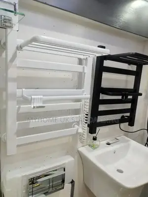 Wall-Mounted Heated Towel Rack With a Top Shelf