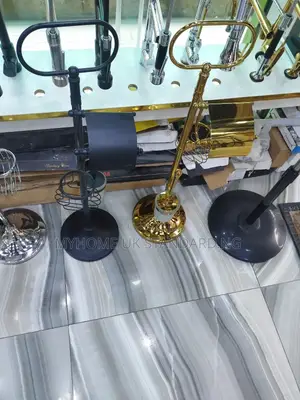 Freestanding Toilet Paper Rolls and a Toilet Brush.