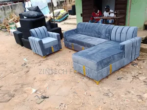 Gray Colour L Shape Sofas and a Single Seater