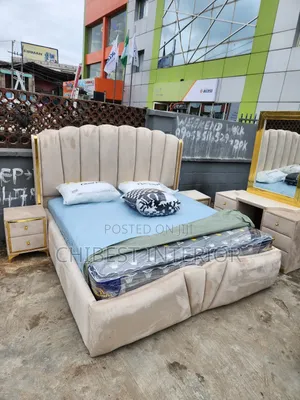 Cream Coloured Family King Size Bed.