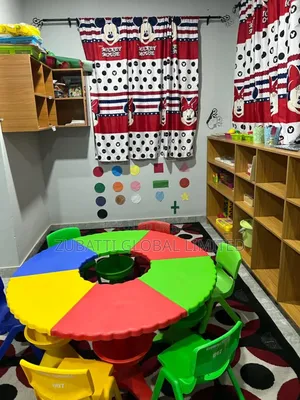 Kindergarten Children Studying Round Table