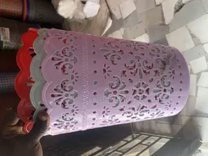 Laundry Basket With a Decorative Floral Lace Design.