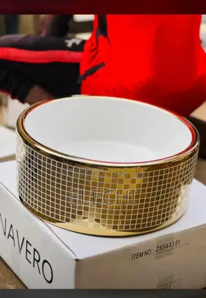 Gold And White Countertops And Pedicure Basin