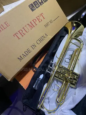 Gold-Colored Yamaha Trumpet With Accessories