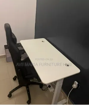 Electric Height Adjustable Desk and Gaming Chair.