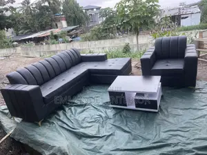 A Standard Leather Sofa With Center Table
