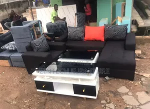 L Shape Sofas Tv Console and a Center Table