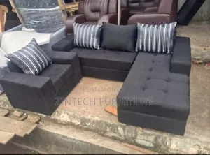 Classy and Well Furnished Black L Shape Sofas and a Single Seater