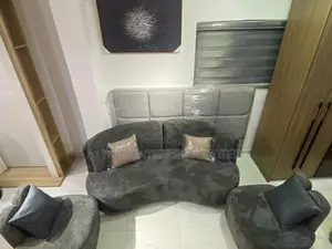 A Modern Wave-shaped Sofa Set In Plush Grey Fabric