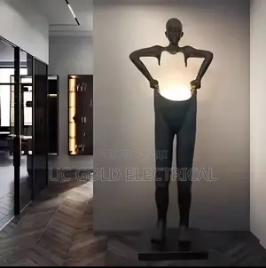Nordic Humanoid Sculpture Floor Lamp Long Arm Holding Ball Creative