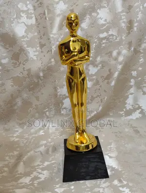 Gold Statue With Black Base